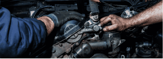 mechanic hands in a car